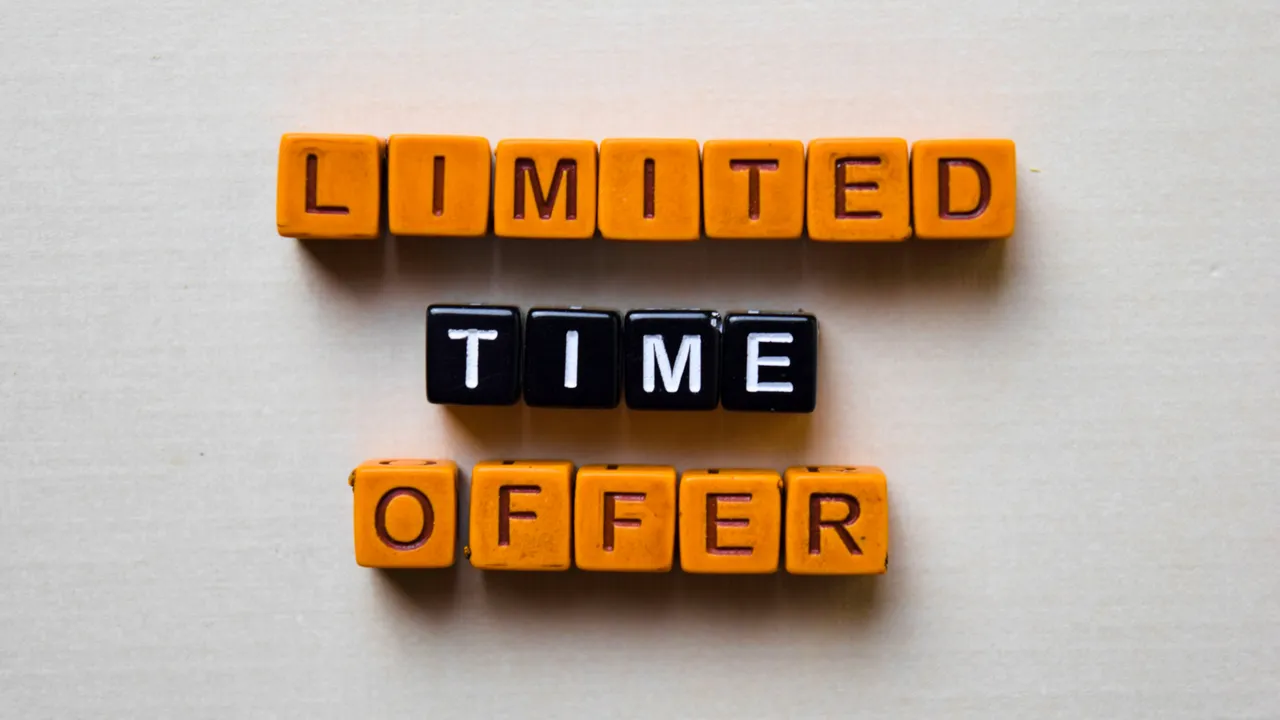 Wooden blocks spelling out “Limited Time Offer” in orange and black, symbolizing urgency and scarcity marketing strategy.