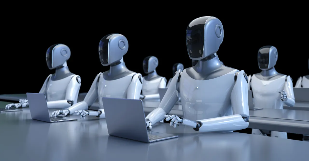 A group of humanoid robots working on laptops in a classroom-like setting, symbolizing AI automation at scale in digital or data-driven tasks.