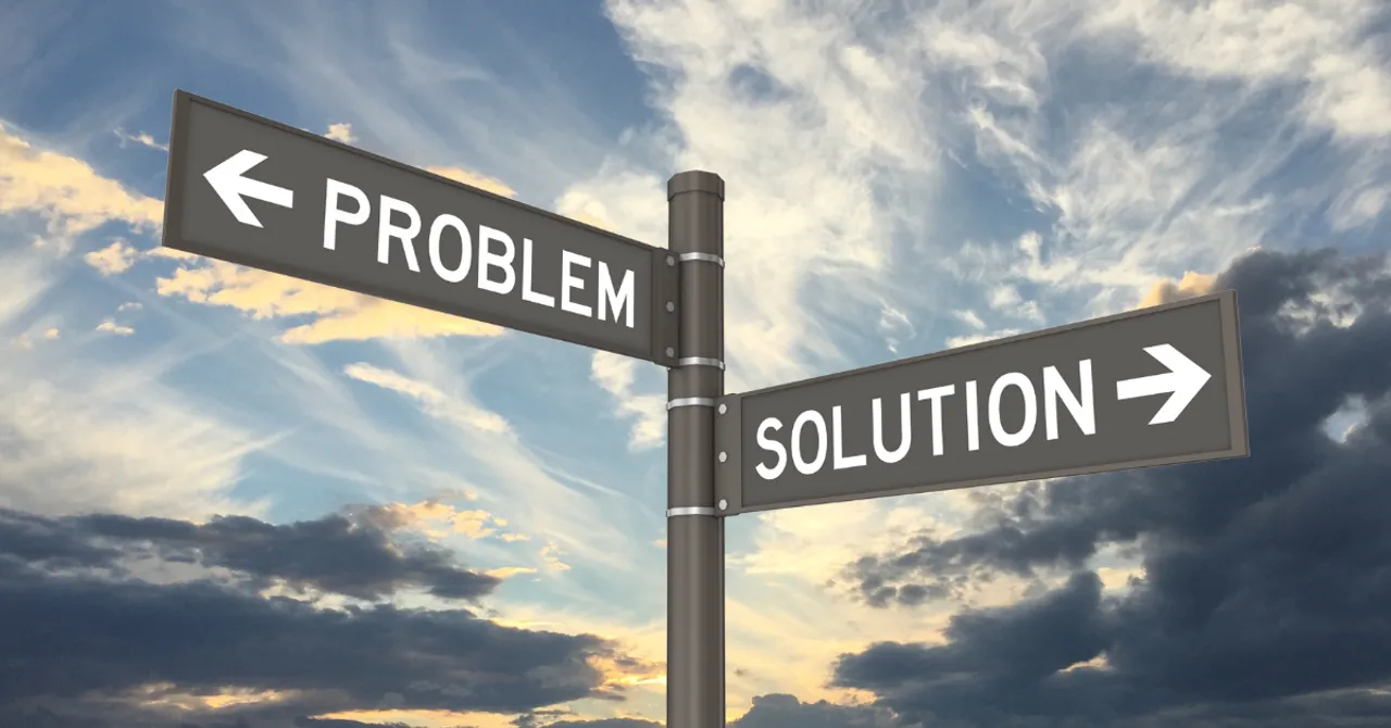 A signpost showing two opposite directions — one labeled "Problem" and the other "Solution" — symbolizing decision-making or problem-solving.