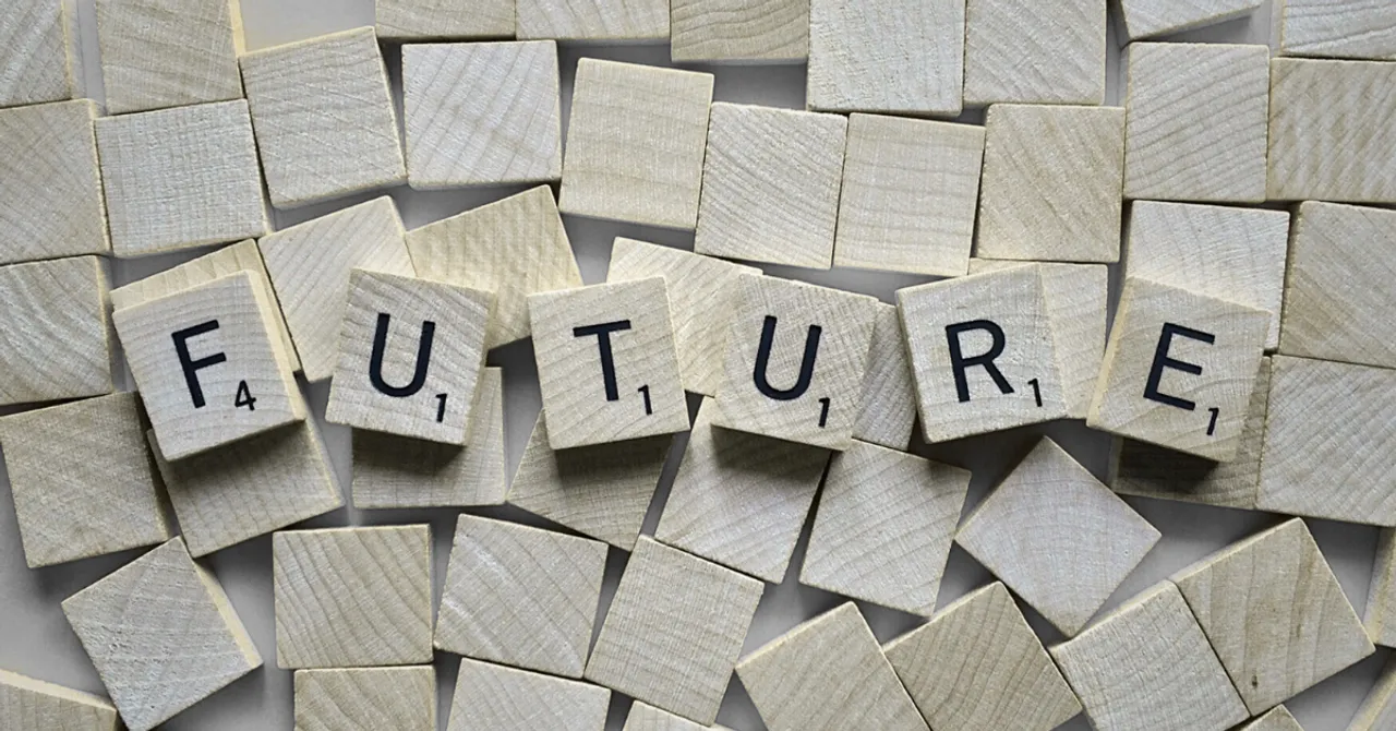 Wooden letter tiles spell out the word "FUTURE" on a scattered background, symbolizing innovation, possibilities, and what lies ahead.