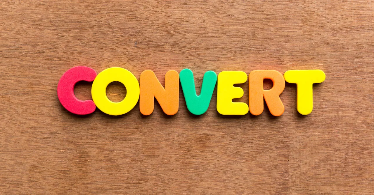 The word "CONVERT" spelled out in colorful foam letters on a wooden background — a playful yet powerful visual symbolizing eCommerce success and turning visitors into customers.