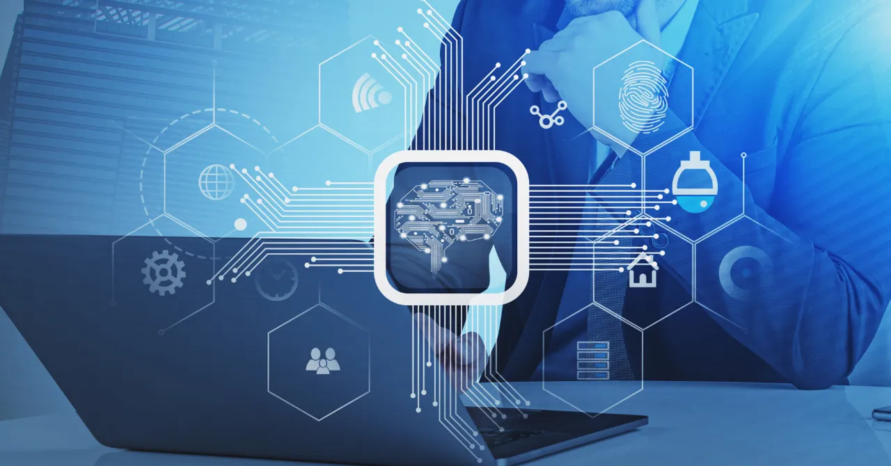A business professional working on a laptop with a digital overlay of a brain chip and technology icons, symbolizing the integration of AI into business operations.