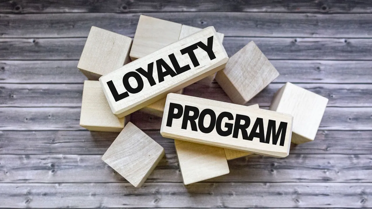 Wooden blocks with bold black text spelling “Loyalty Program” – representing the foundation of customer retention strategies in modern e-commerce.