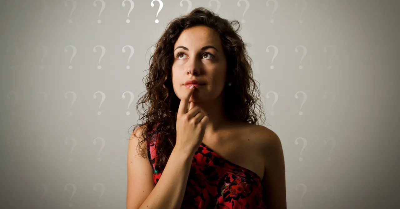 A woman thinking with question marks around her — representing the confusion shoppers face when choosing the right skincare, and the opportunity for AI to offer smarter, personalized guidance.